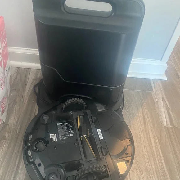 Shark robot iq robot vacuum with self emptying container.
